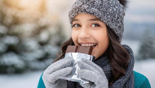 KI generated, Young girl, 15, years, eating a bar of chocolate, one person, outdoor shot, ice,