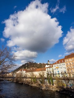 View over the river Mur to the Schlossberg with clock tower, Graz, Styria, Austria, Europe