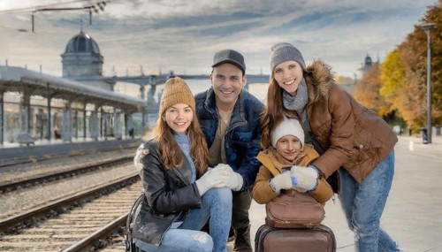 AI generated, A young family wants to travel and waits in the station for the train, 30, 35, years,