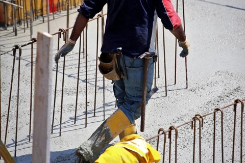 Concreting a floor slab with ready-mixed concrete on the construction site of a residential