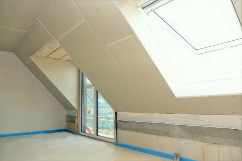 Attic conversion, loft conversion. You can see the pitched roof with door and skylight panelled