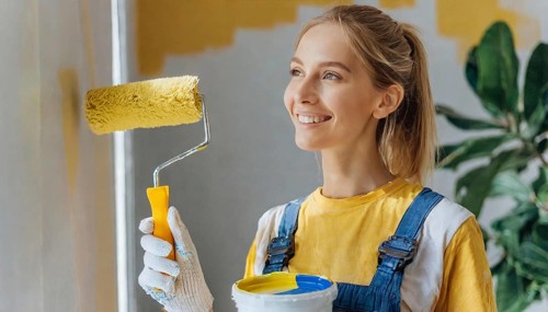 AI generated, woman, woman, a young girl paints a wall with new paint, yellow, yellow, renovation