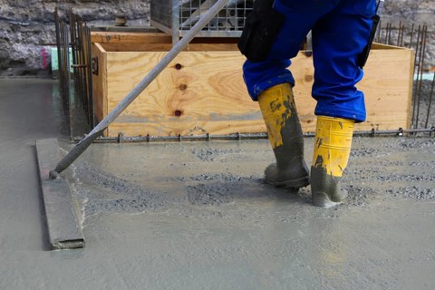 Concreting a floor slab with ready-mixed concrete on the construction site of a residential