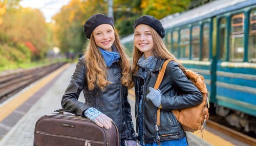 AI generated, Two young blonde woman want to travel and wait in the station for the train, 18,