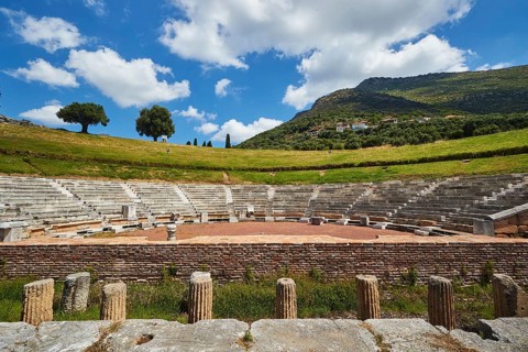 Ancient theatre with semi-circular rows of seats and stage, surrounded by nature, Ancient theatre,