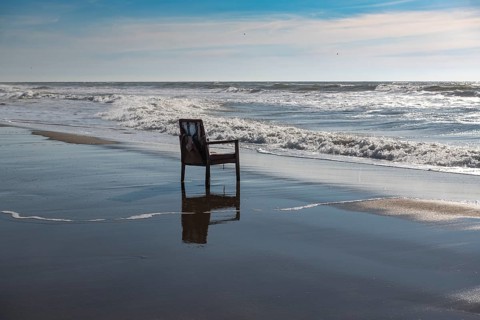 Upholstered chair washed up on the North Sea shore, flotsam, Oksbol, Region Syddanmark, Denmark,