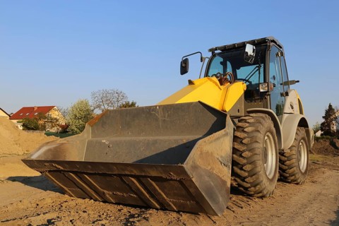 Wheel loader at sunset, here in the Ringstrasse development area (Mutterstadt,