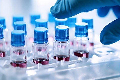 Small vials and hand with blue medical glove in research lab. KI generiert, generiert AI generated