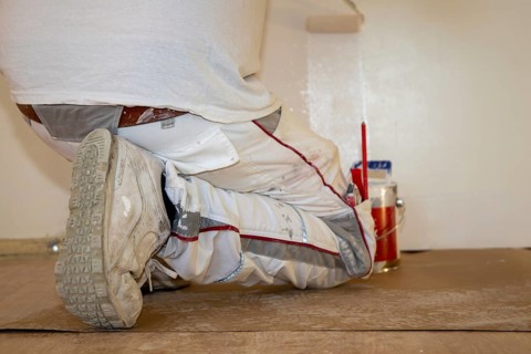 Painter renovates an old flat