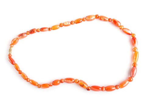 Colored onyx beads isolated on white background. top view, close up
