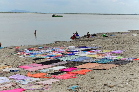 Washing clothes in the Irrawaddy, Myanmar, Asia