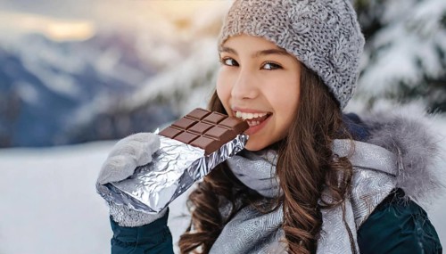 KI generated, Young girl, 15, years, eating a bar of chocolate, one person, outdoor shot, ice,