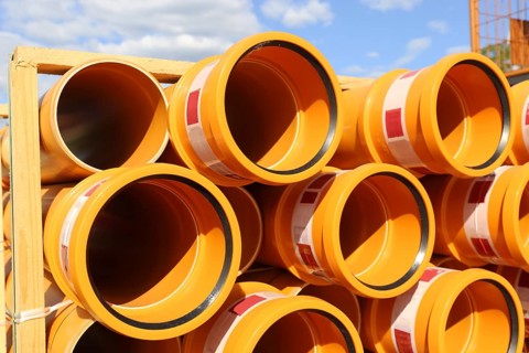 Stack of KG pipes on a construction site in the Mutterstadt development area, Rhineland-Palatinate
