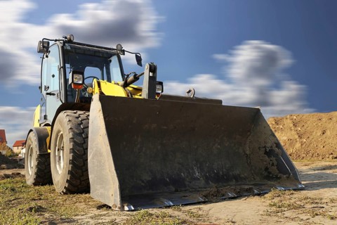 Wheel loader at sunset, here in the Ringstrasse development area (Mutterstadt,