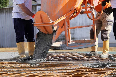 Concreting a floor slab with ready-mixed concrete on the construction site of a residential