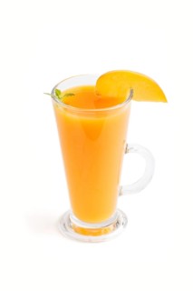 Glass of peach juice isolated on white background. Morninig, spring, healthy drink concept. Side