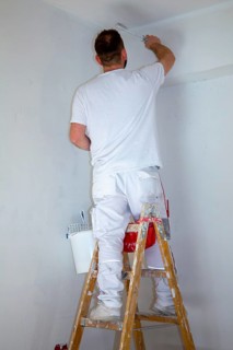 Painter renovates an old flat