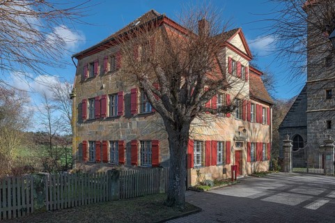 Historic vicarage of St Egidienkirche from 1734, in front of it a trimmed summer lime tree (Tilia
