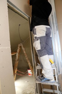 Craftsmen doing drywall work
