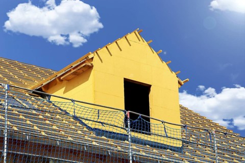 Roofer working on a new dormer window