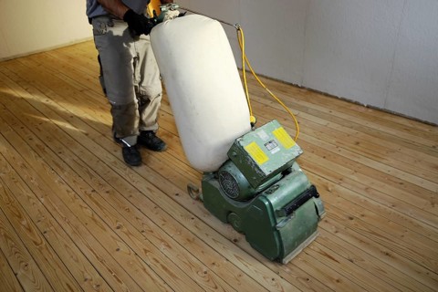 A parquet floor is sanded and oiled