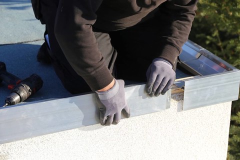 Tinsmith work on a flat roof