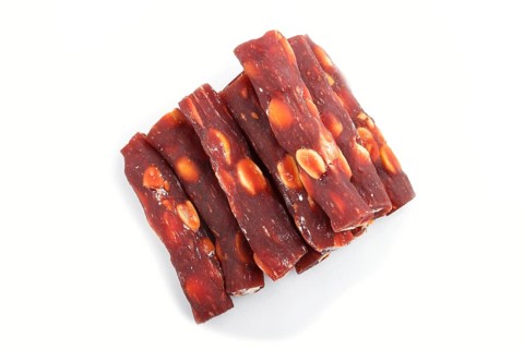 Brown traditional turkish delight (rahat lokum) with peanuts isolated on white background. top
