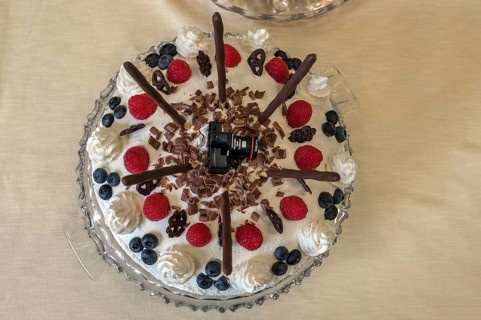 Black forest cake with mini camera at a photo exhibition, Eckental, Middle Franconia, Bavaria,