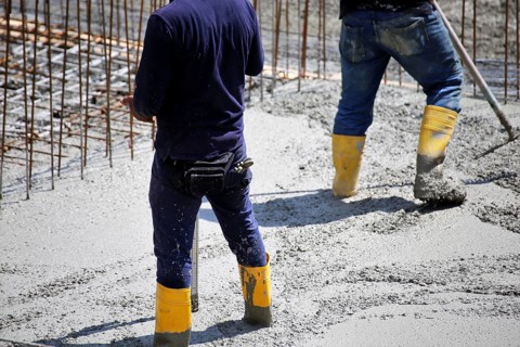 Concreting a floor slab with ready-mixed concrete on the construction site of a residential