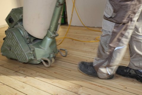 A parquet floor is sanded and oiled