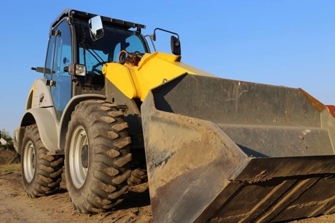 Wheel loader at sunset, here in the Ringstrasse development area (Mutterstadt,