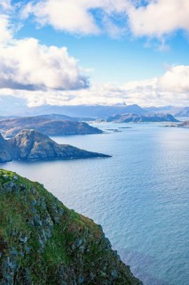 View of a fjord landscape with a rocky coast on the Norwegian coast, Runde, Heroy, Norway, Europe