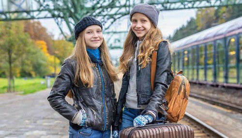AI generated, Two young blonde woman want to travel and wait in the station for the train, 18,