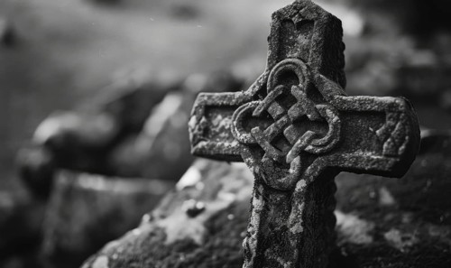 Black and white image of a Celtic cross on a grave in a cemetery, copy space. AI generated