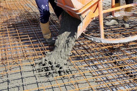 Concreting a floor slab with ready-mixed concrete on the construction site of a residential