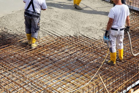 Delivery of ready-mixed concrete to the construction site of a residential building in a new
