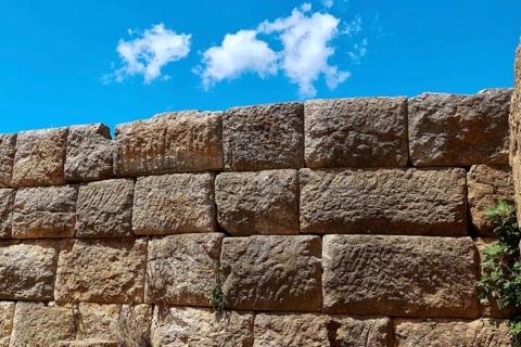 Detail of an old stone wall with visible stone structures, Archaeological site, Ancient Messene,