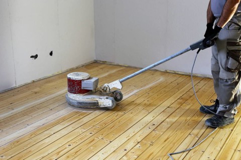 A parquet floor is sanded and oiled