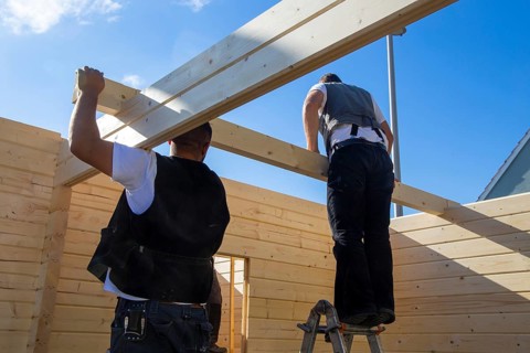 Timber construction: Carpenters assembling a garden sauna in Mutterstadt in the Rhein-Pfalz
