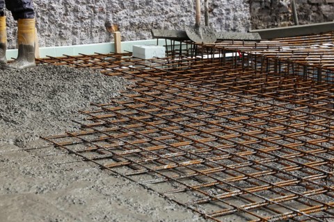 Concreting a floor slab with ready-mixed concrete on the construction site of a residential