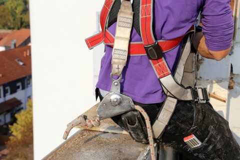 Roofer with fall protection