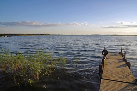 Small, deserted jetty on a lake in the evening light, Kristinehamm, Goeta Canal, Goetaland, Sweden,