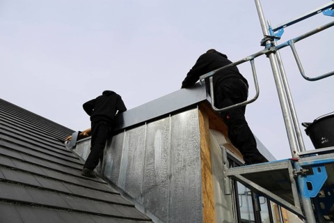 Roofer working on a new dormer window