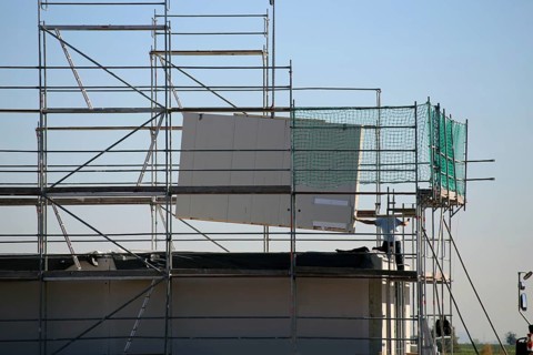 Prefabricated house under construction, the exterior walls are being delivered (Bad Duerkheim,