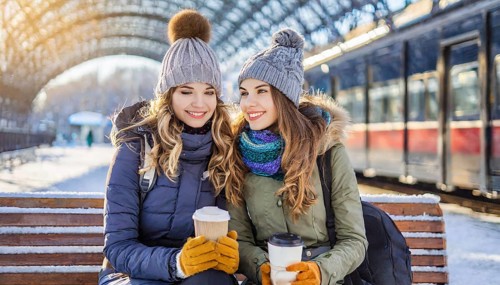 AI generated, Two young blonde woman want to travel and wait in the station for the train, 20, 25,