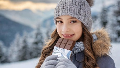 KI generated, Young girl, 15, years, eating a bar of chocolate, one person, outdoor shot, ice,