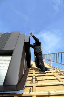 Roofer working on a new dormer window