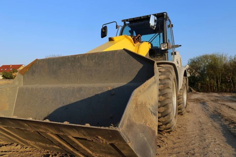Wheel loader at sunset, here in the Ringstrasse development area (Mutterstadt,