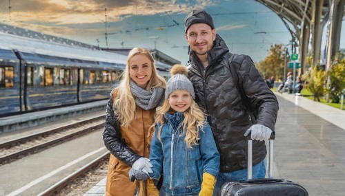 AI generated, A young family wants to travel and waits in the station for the train, 30, 35, years,