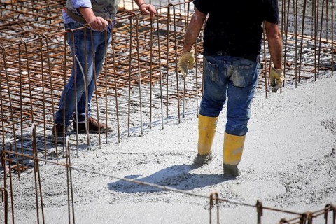 Concreting a floor slab with ready-mixed concrete on the construction site of a residential
